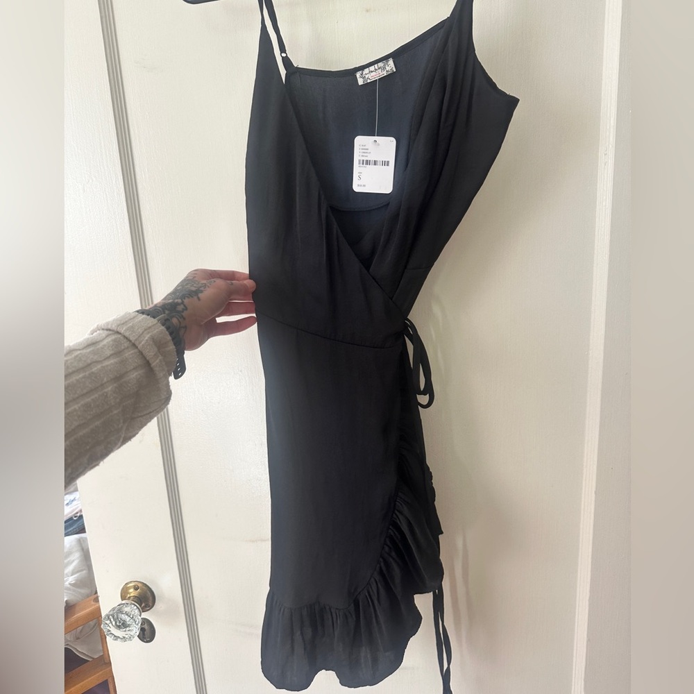 New with tags free people black tie dress, soft silk material